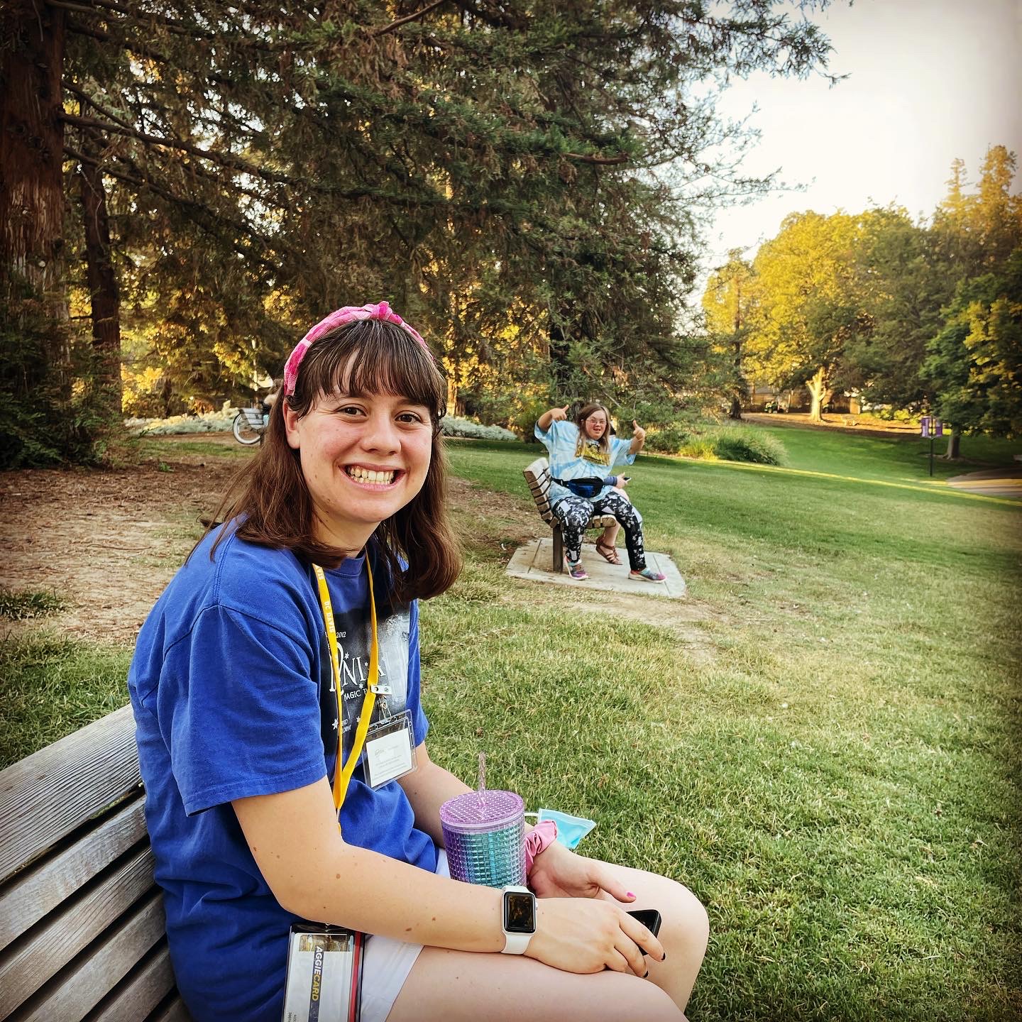 two students having fun in the arboretum