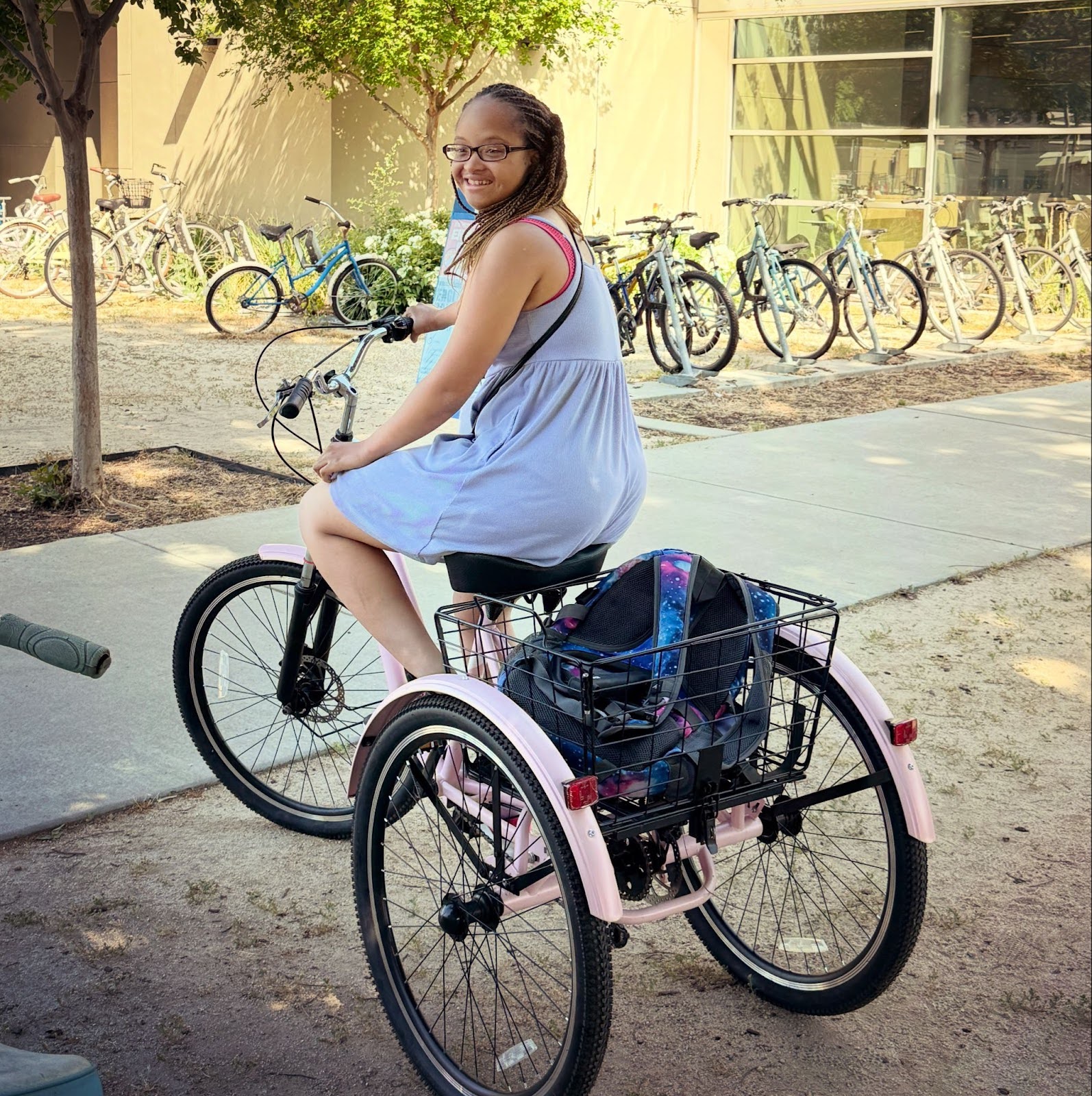 student on three wheel bike