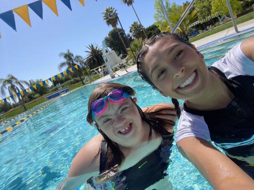 student and mentor in a swimming pool