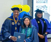 a woman gets her diploma